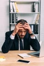 portrait of stressed businessman at workplace with laptop Royalty Free Stock Photo