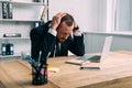 portrait of stressed businessman at workplace with laptop Royalty Free Stock Photo