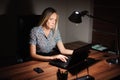 Portrait of stressed businesswoman sitting at office desk Royalty Free Stock Photo