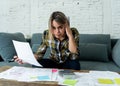 Portrait of stressed and overwhelmed young woman accounting home and business finances paying bills Royalty Free Stock Photo