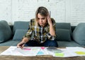 Portrait of stressed and overwhelmed young woman accounting home and business finances paying bills Royalty Free Stock Photo