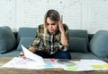Portrait of stressed and overwhelmed young woman accounting home and business finances paying bills Royalty Free Stock Photo