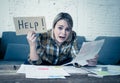 Portrait of stressed and overwhelmed young woman trying to manage home finances paying bills Royalty Free Stock Photo