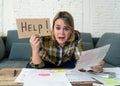 Portrait of stressed and overwhelmed young woman trying to manage home finances paying bills Royalty Free Stock Photo