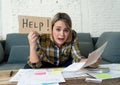 Portrait of stressed and overwhelmed young woman trying to manage home finances paying bills Royalty Free Stock Photo