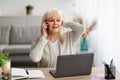 Surprised shocked senior woman talking on mobile phone