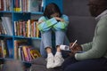 Stressed teenage girl crying in mental health therapy Royalty Free Stock Photo