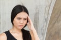 Portrait of stressed woman with a headache, stress, migraine, ha