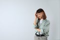 Portrait of stressed young girl on white background. Space for text Royalty Free Stock Photo