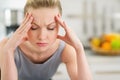 Portrait of stressed young housewife in kitchen Royalty Free Stock Photo