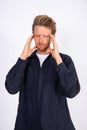 Portrait of stressed young man suffering from headache Royalty Free Stock Photo