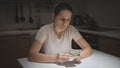 Portrait of stressed young woman having financial problems counting her few money. Concept of financial difficulties Royalty Free Stock Photo
