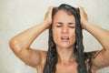 Portrait of stressed young woman in shower Royalty Free Stock Photo