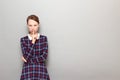 Portrait of strict girl showing silence gesture with finger over lips