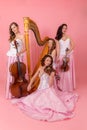 String quartet on a pink background Royalty Free Stock Photo