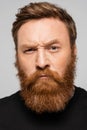 portrait of stringent bearded man frowning Royalty Free Stock Photo