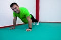 Portrait of a strong determined young man doing push-ups Royalty Free Stock Photo