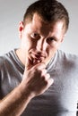 Portrait of strong healthy handsome Athletic Man Fitness Model posing near dark gray wall Royalty Free Stock Photo