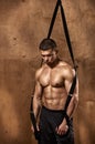 Bodybuilder with suspension rope