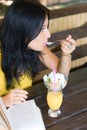 Portrait student girl eating dessert