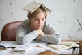 Portrait of student girl with open book on her head Royalty Free Stock Photo