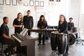 Portrait Of Students At Performing Arts School Playing In Band At Rehearsal With Teacher Royalty Free Stock Photo