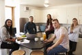 Portrait Of Students Relaxing In Kitchen Of Accommodation Royalty Free Stock Photo