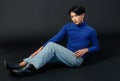 Portrait studio closeup full body shot of Asian young sexy luxury glamour slim fashionable LGBTQ gay male model in turtleneck long Royalty Free Stock Photo