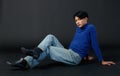 Portrait studio closeup shot of Asian young sexy luxury glamour slim fashionable LGBTQ gay male model in turtleneck long sleeve Royalty Free Stock Photo
