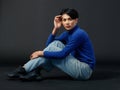 Portrait studio closeup shot of Asian young sexy luxury glamour slim fashionable LGBTQ gay male model in turtleneck long sleeve Royalty Free Stock Photo