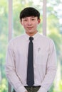 Portrait studio shot of Asian professional successful male businessman employee in formal shirt with necktie standing look at Royalty Free Stock Photo