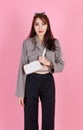 Asian trendy fashionable female hipster teen model in casual crop top street wears jacket sunglasses carrying leather handbag purs Royalty Free Stock Photo