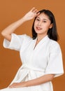 Portrait studio shot of millennial young Asian short black hair female model in white shower rope standing smiling look at camera Royalty Free Stock Photo