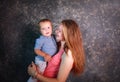 Young mother with her little son in arms happy together Royalty Free Stock Photo