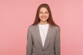 Portrait of stunning happy fashionable woman in business suit smiling at camera, looking successful and professional Royalty Free Stock Photo