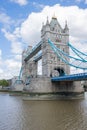 The Iconic Tower Bridge Over the River Thames and Under a Cloudy Blue Sky Royalty Free Stock Photo