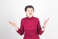 Portrait of stylish, aged, charming, surprised, shocked woman over grey background Royalty Free Stock Photo