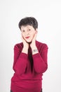 Portrait of stylish, aged, charming, surprised, shocked woman over grey background Royalty Free Stock Photo