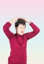Portrait of stylish, aged, charming, surprised, shocked woman over grey background Royalty Free Stock Photo