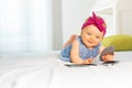 Portrait of stylish baby girl leaf through book Royalty Free Stock Photo