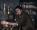 Portrait of stylish barman making a cocktail