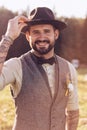 Portrait of stylish beard, male with tattoos on his arms. Wedding portrait