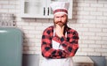 Portrait of stylish bearded cook on a kitchen.