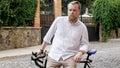 Portrait of stylish bearded man posing with vintage bicycle Royalty Free Stock Photo