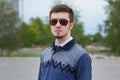 Portrait of stylish brunet young man, wearing sunglasses Royalty Free Stock Photo