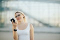 Business lady in glasses talking on the phone and smiling Royalty Free Stock Photo