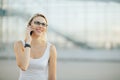 Stylish business lady in glasses talking on the phone and smiling Royalty Free Stock Photo