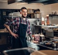 Portrait of stylish cook on a kitchen. Royalty Free Stock Photo