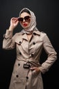 Portrait of stylish female model in trench coat. Royalty Free Stock Photo