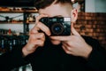 Portrait of stylish handsome man with camera Royalty Free Stock Photo